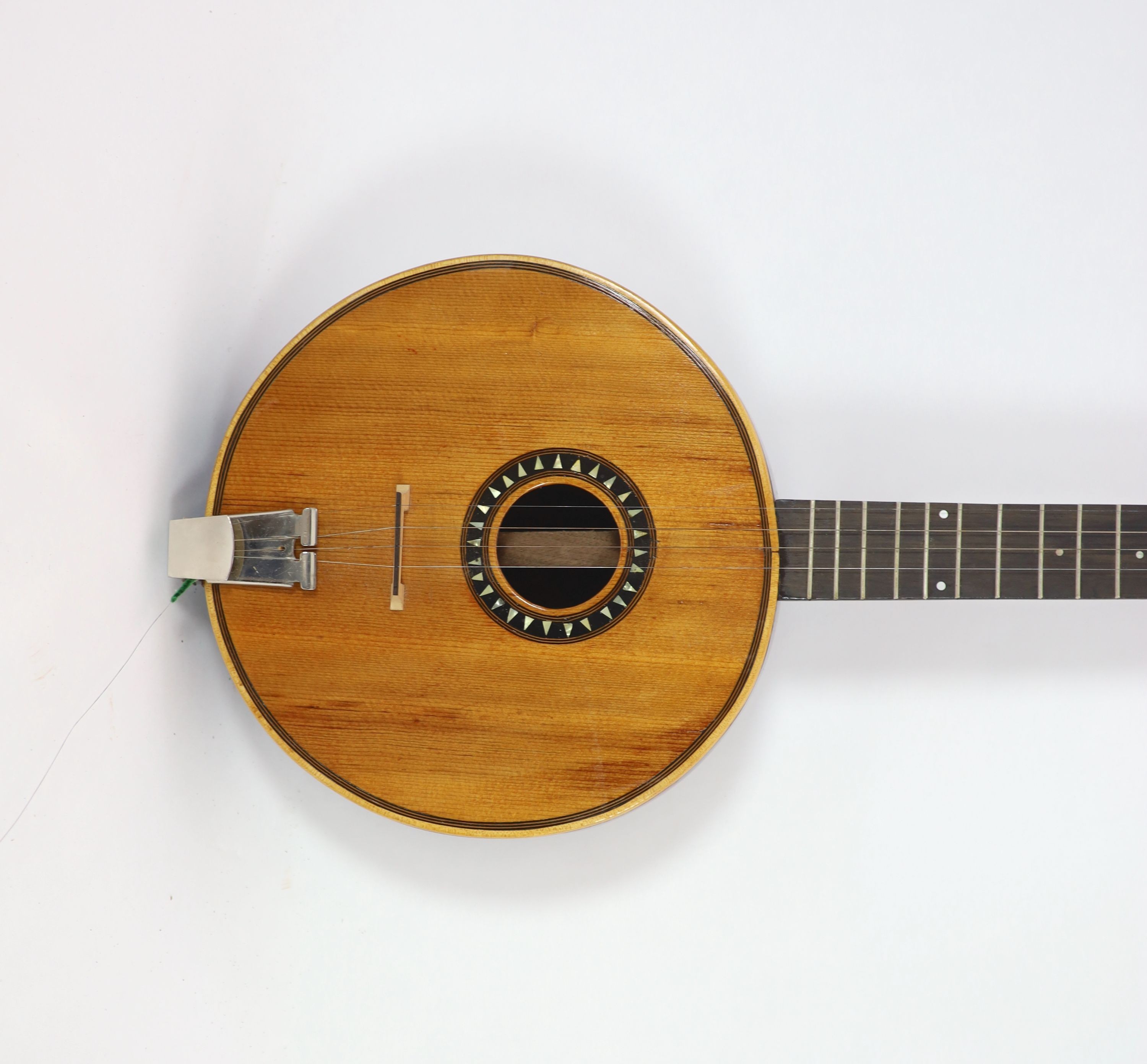 A wooden banjo length 95cm